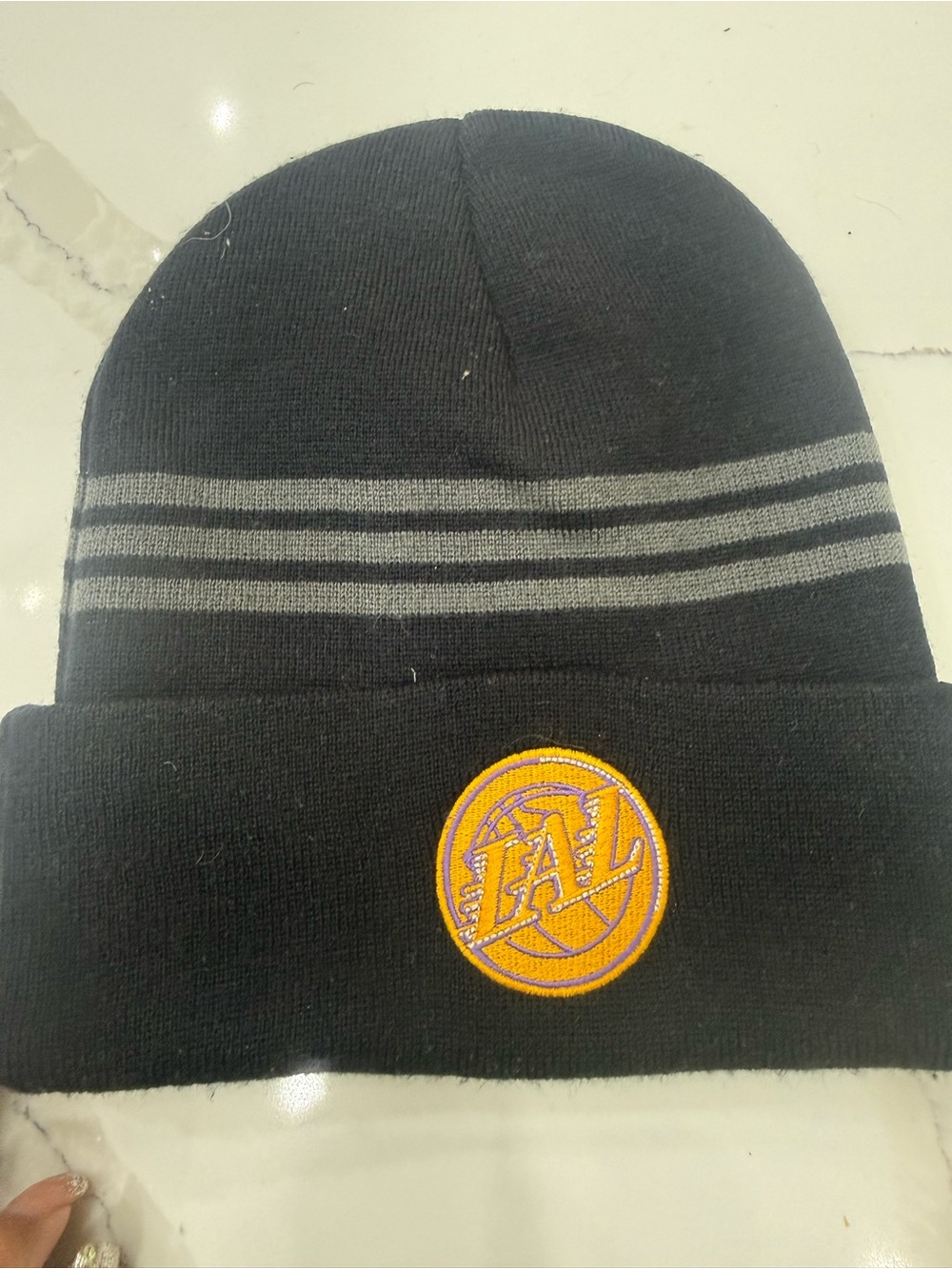 Black Knit Beanie with Grey Stripe Accents and Embroidered Team Patch